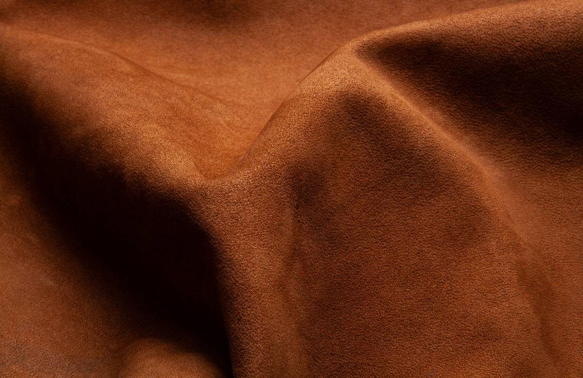 eco beauty advantages — natural makeup products arranged on reusable cloth with greenery