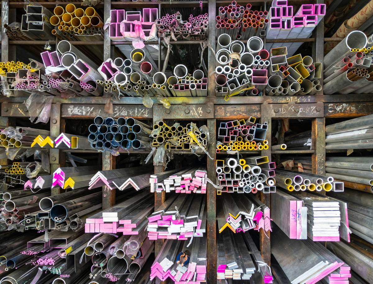 Recyclable Materials — glass bottles, aluminum compacts, and cardboard boxes sorted for recycling